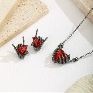 Eye Candy Red Heart Earrings with Silver Skeleton Design